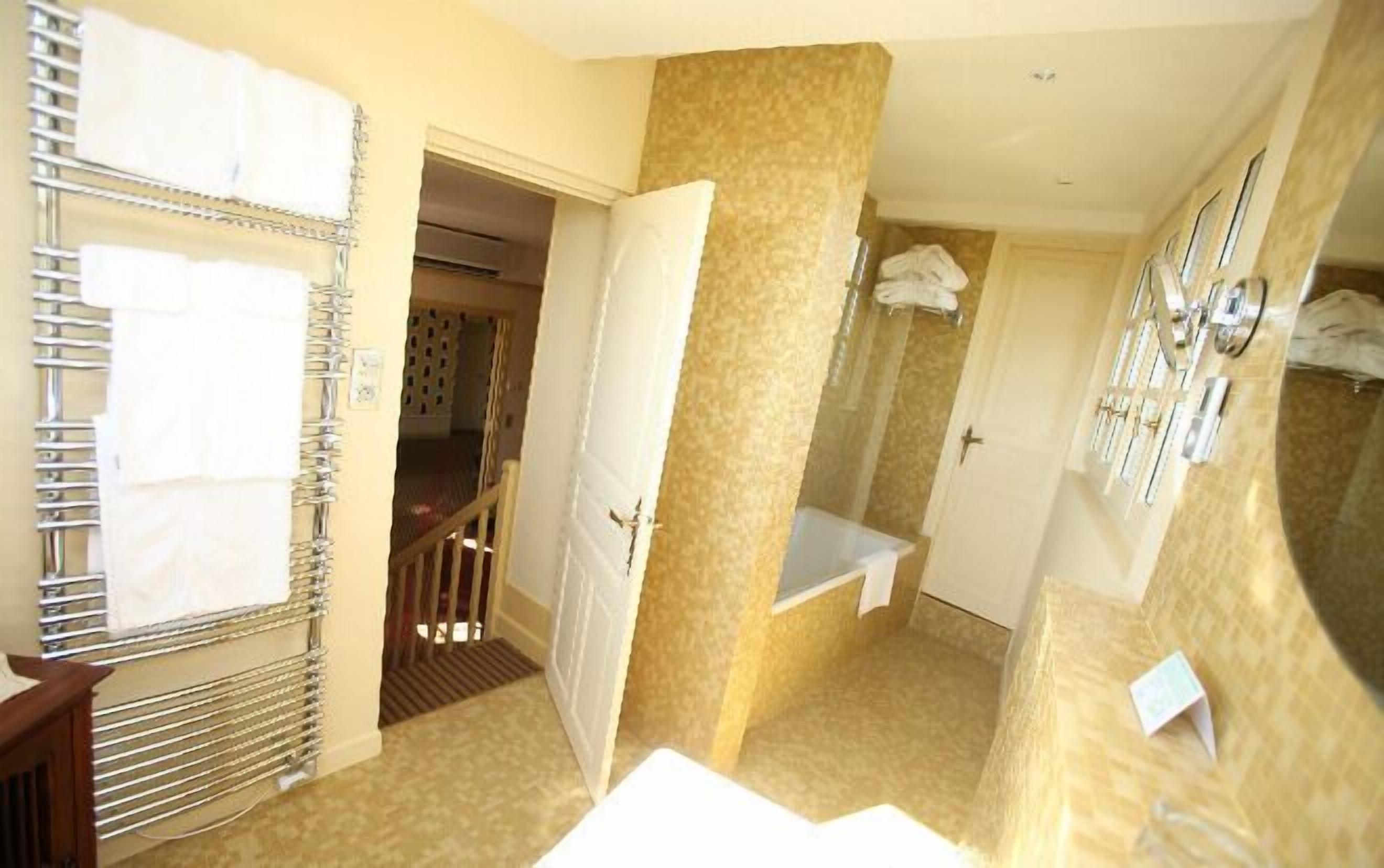 combined shower/bathtub, free toiletries, hair dryer, bathrobes