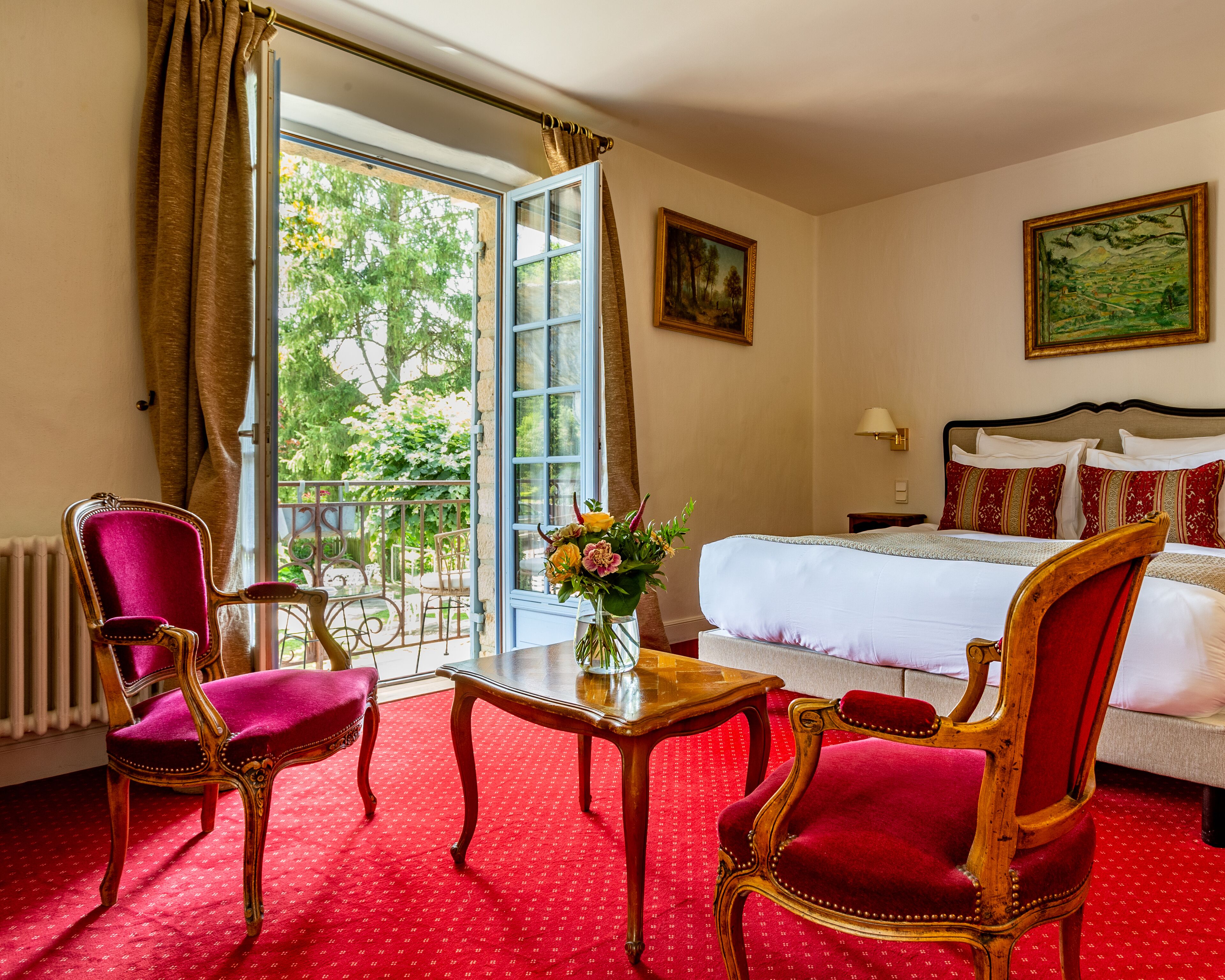 deluxe room, balcony, pool view | living area | 80-inch tv with cable channels