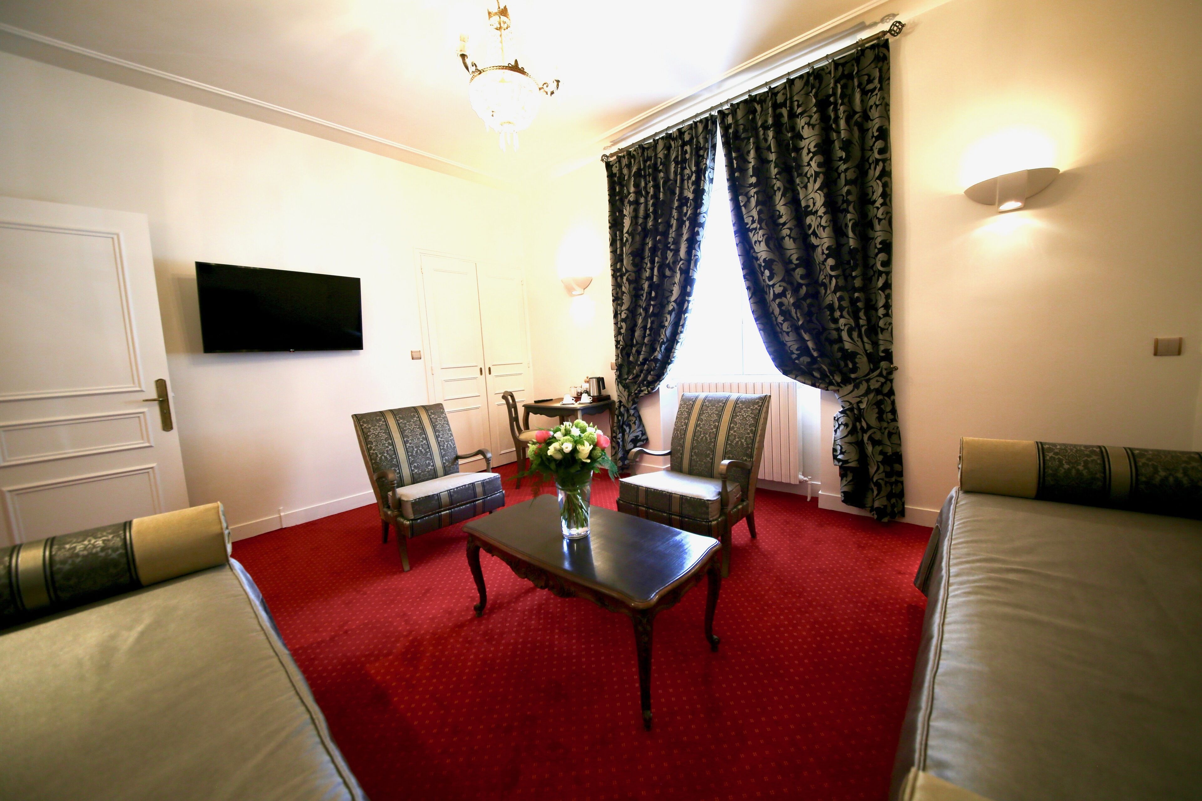 luxury suite | living area | 80-inch tv with cable channels