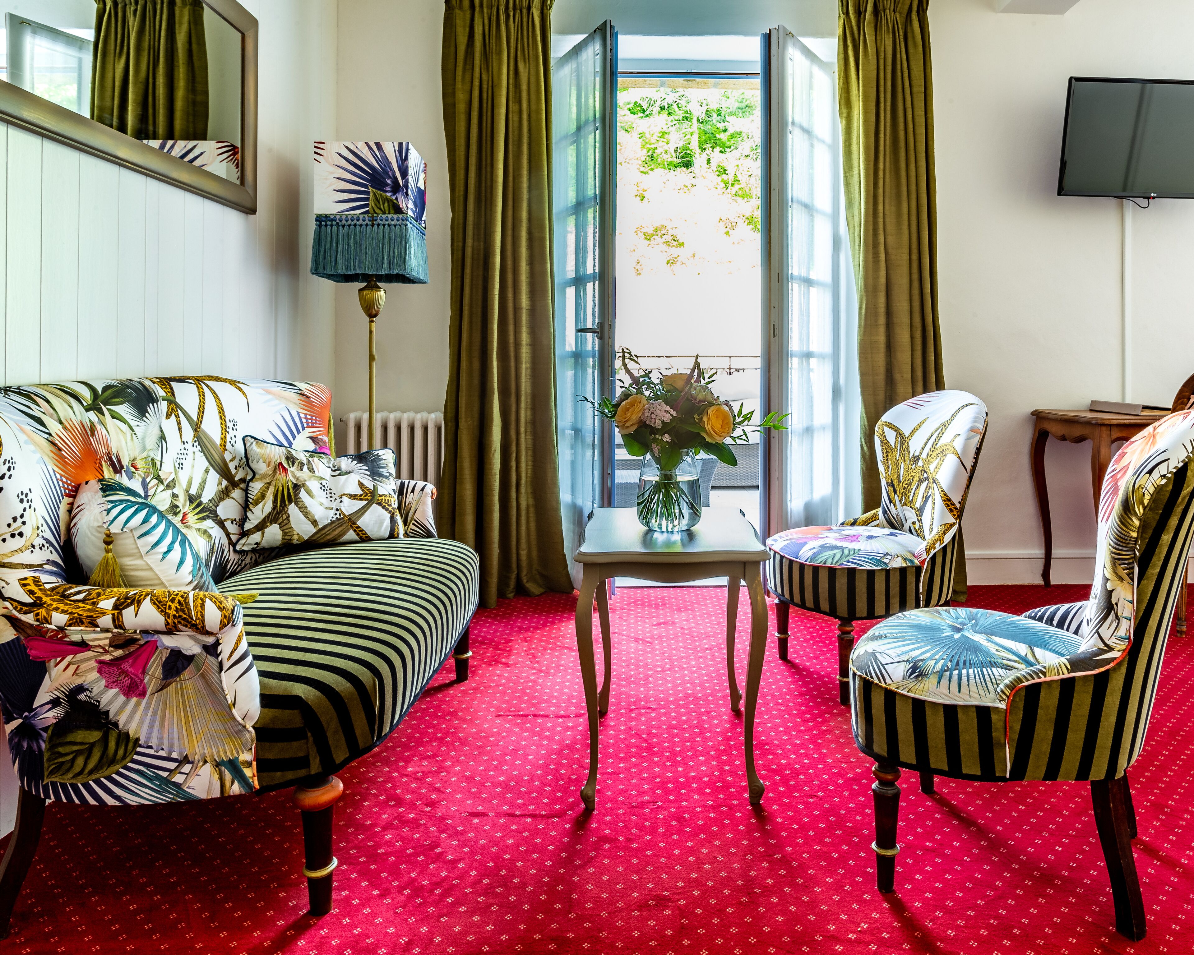 deluxe room, terrace | living area | 80-inch tv with cable channels