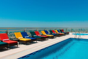 Outdoor pool, open 6:00 AM to 10:00 PM, sun loungers