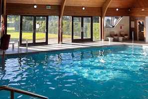 Indoor pool, open 7:00 AM to 9:00 PM, pool loungers