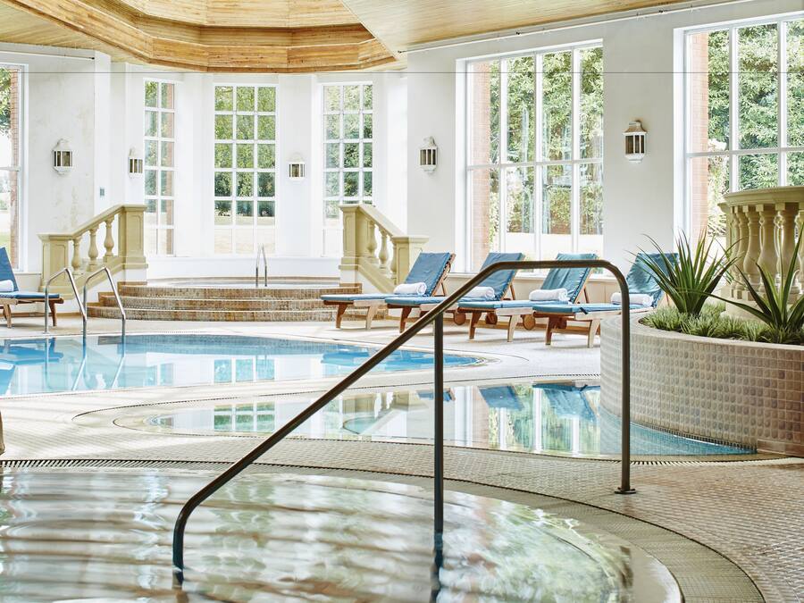 Indoor pool, open 7:00 AM to 9:00 PM, pool loungers