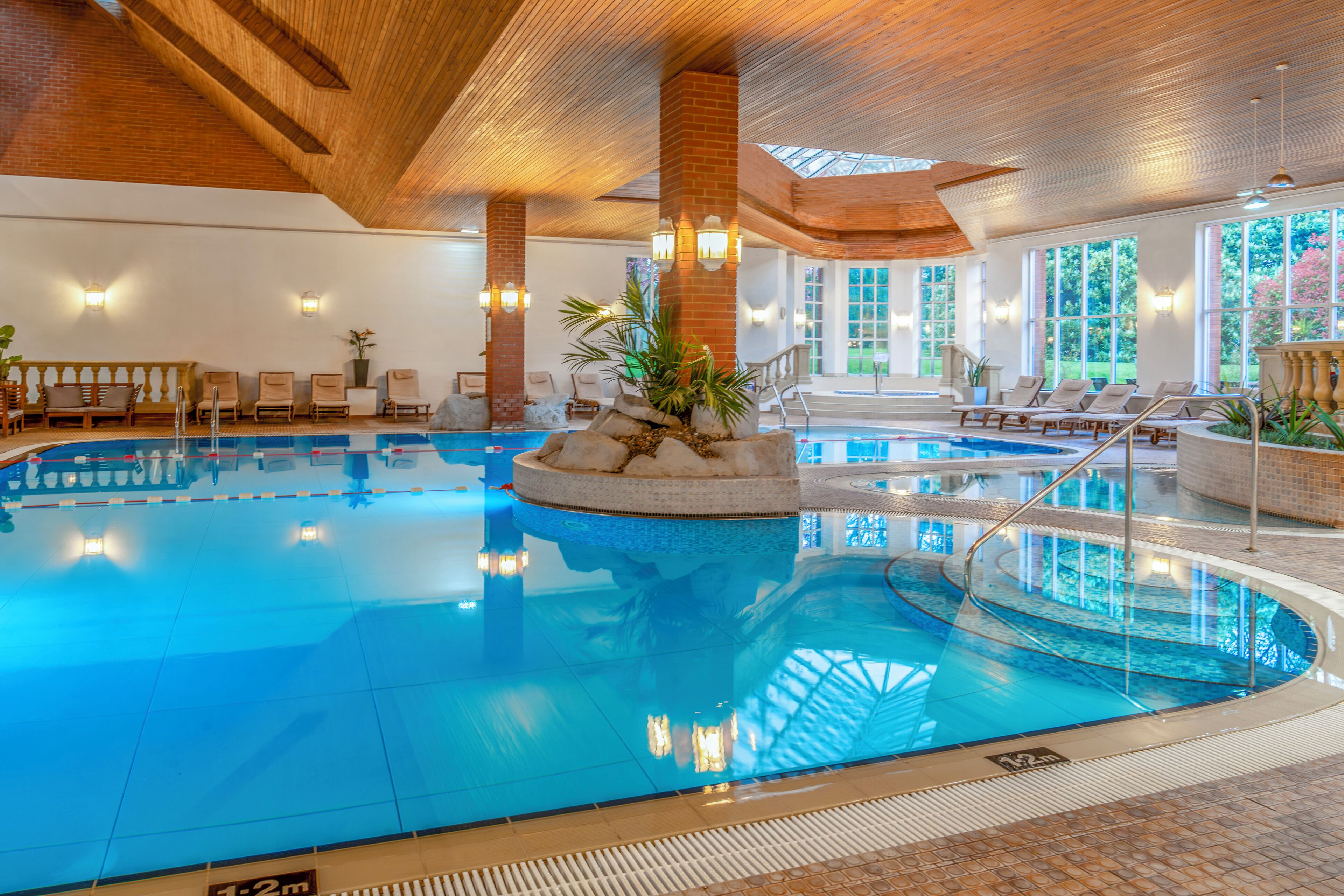 Indoor pool, open 7:00 AM to 9:00 PM, pool loungers