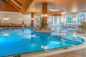 Indoor pool, open 7:00 AM to 7:00 PM, pool loungers