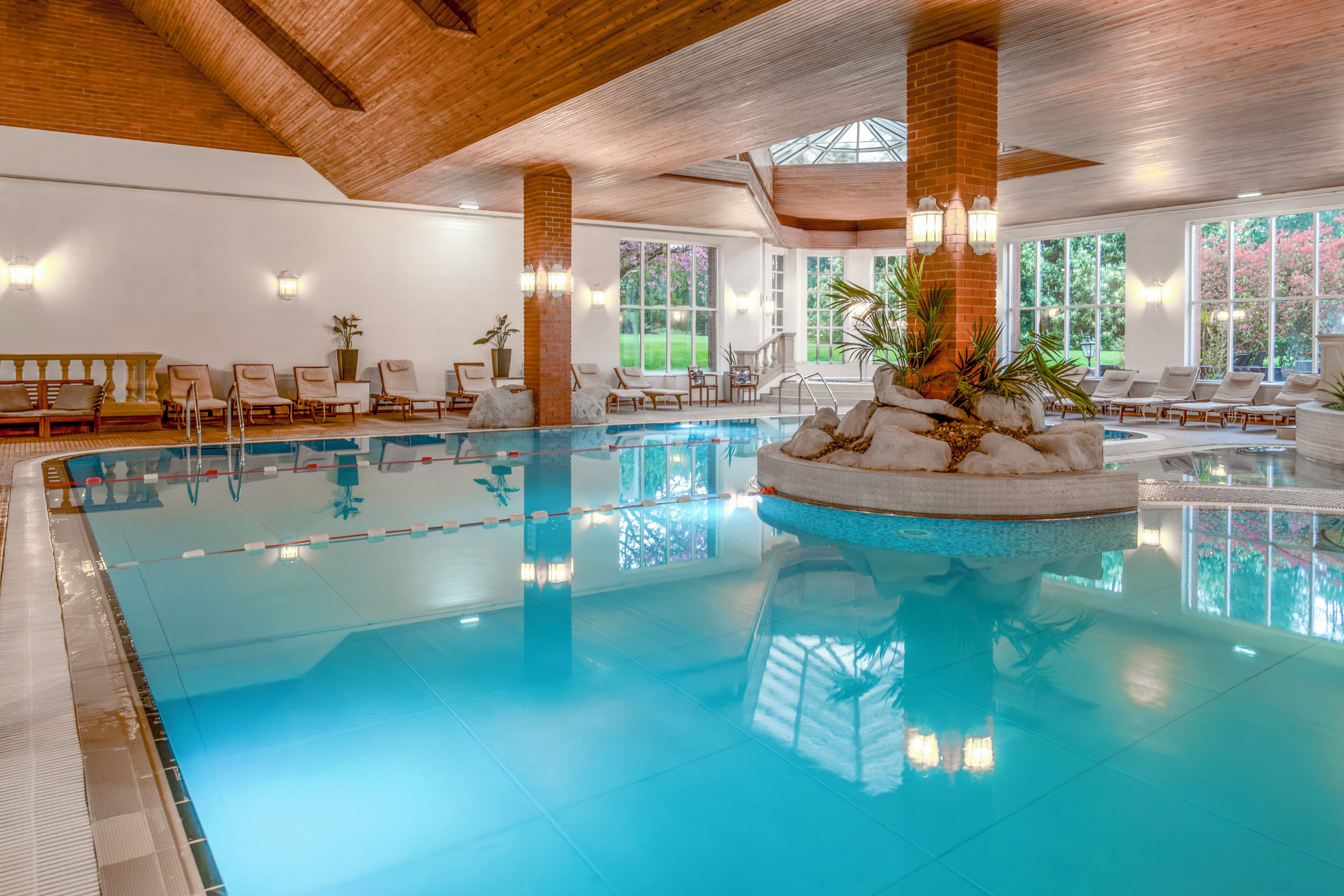Indoor pool, open 7:00 AM to 7:00 PM, pool loungers
