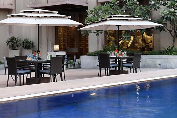 Outdoor pool, open 6:30 AM to 10:00 PM, pool umbrellas, pool loungers