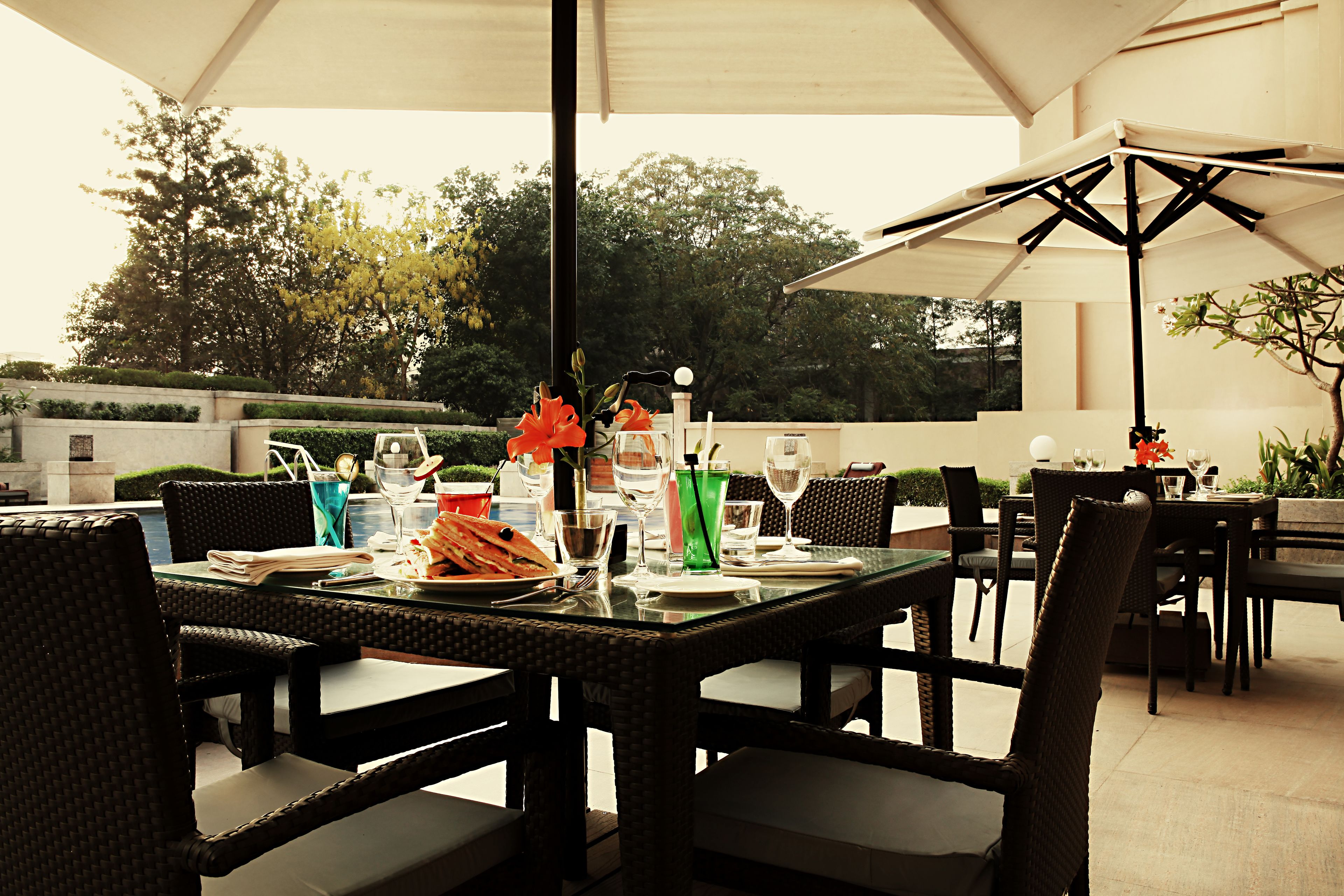 outdoor pool, open 6:30 am to 10:00 pm, pool umbrellas, pool loungers