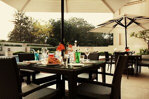 Outdoor pool, open 6:30 AM to 10:00 PM, pool umbrellas, pool loungers