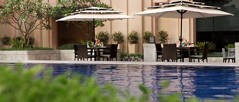 Outdoor pool, open 6:30 AM to 10:00 PM, pool umbrellas, pool loungers