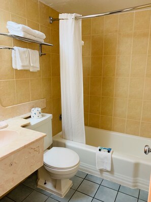 Double Room (2 Double Beds) | Bathroom | Combined shower/bathtub, hair dryer, towels