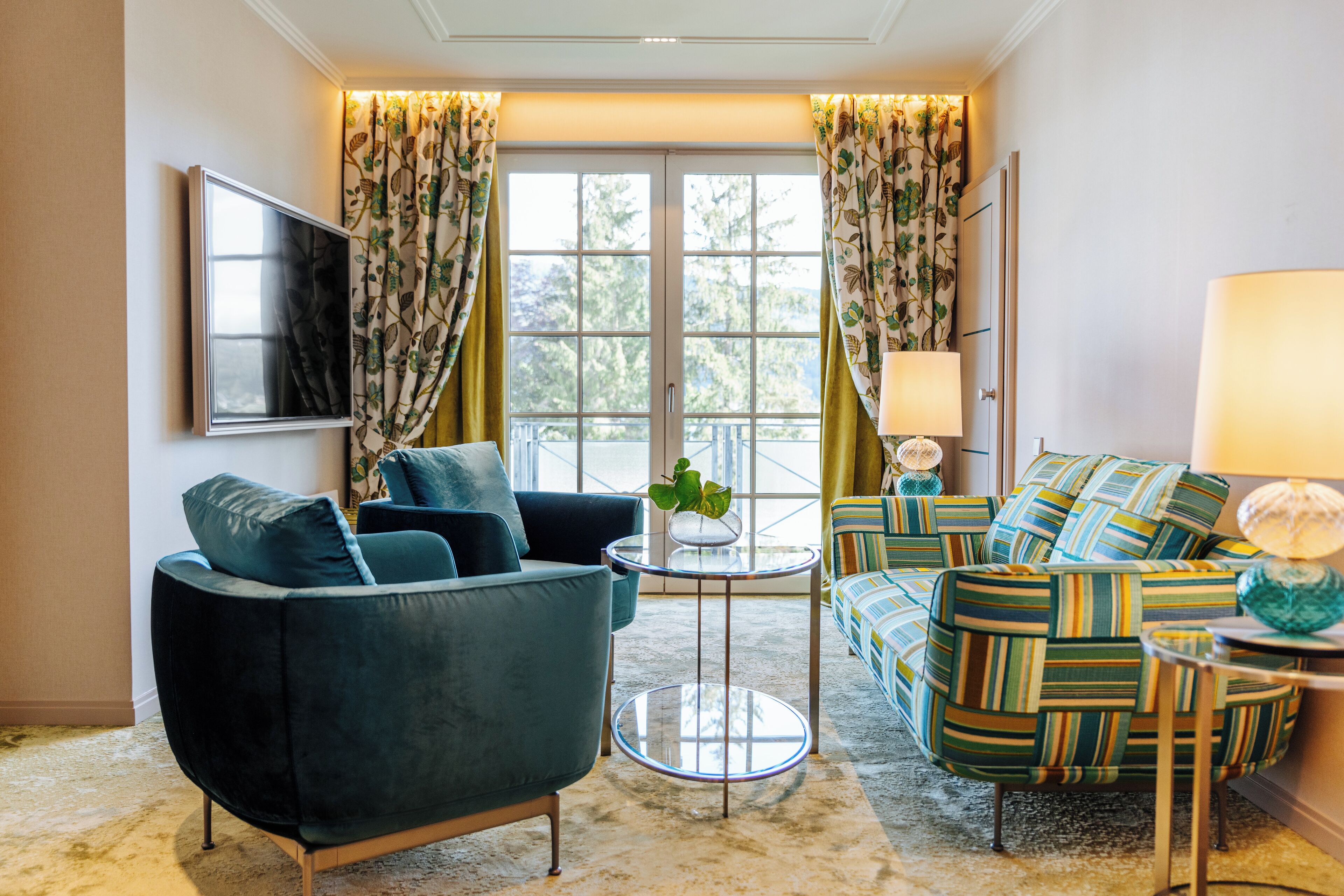 A living room with a sofa, armchair, and a small coffee table.