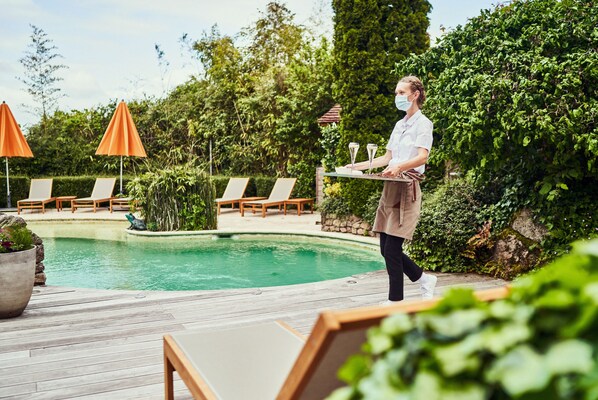 Seasonal outdoor pool, pool umbrellas, pool loungers