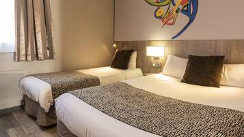 A hotel room with two beds, a large abstract painting on the wall, and a window with curtains.