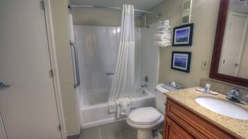 Combined shower/tub, hair dryer, towels, soap