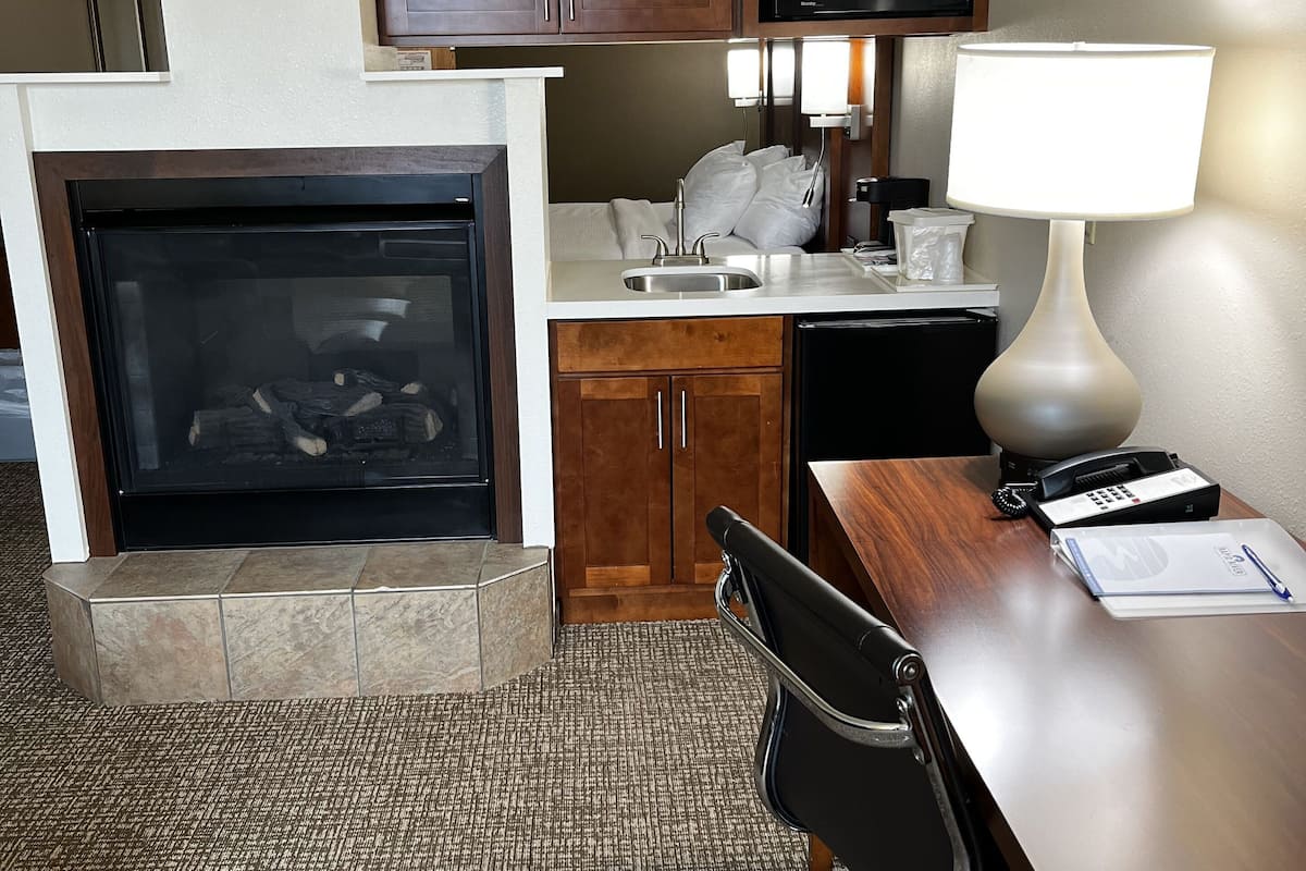 desk, laptop workspace, blackout curtains, iron/ironing board