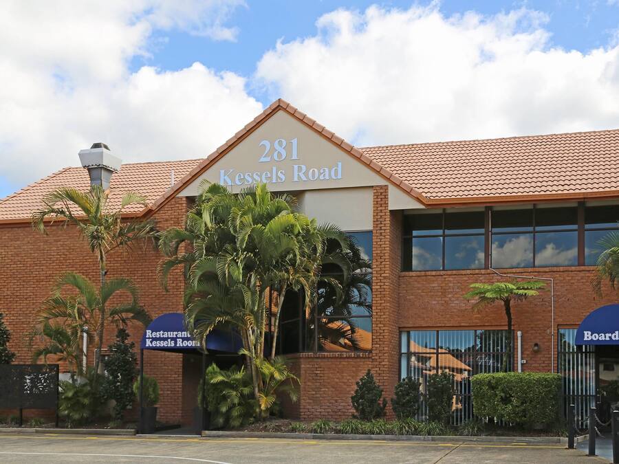 A building with a sign reading '281 Kessels Road' and two entrance signs for 'Restaurant Kessels Room' and 'Boardroom'.