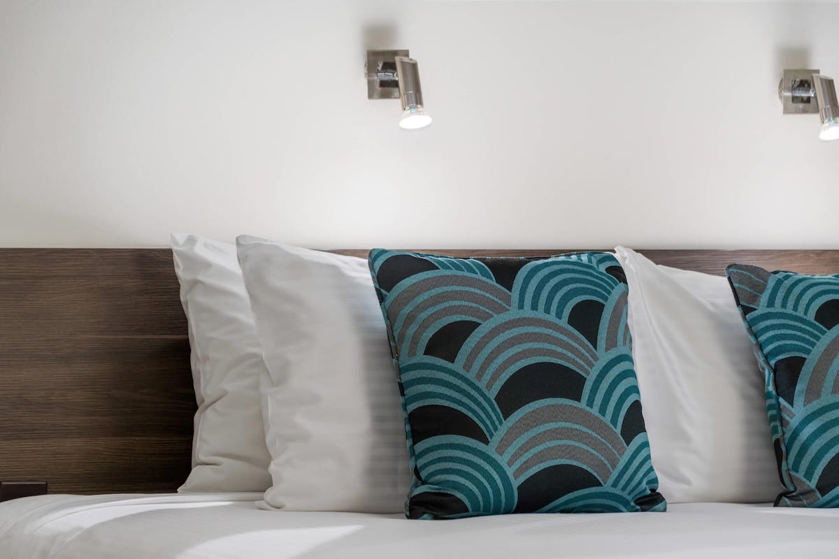 Premium bedding, pillow-top beds, blackout curtains, soundproofing