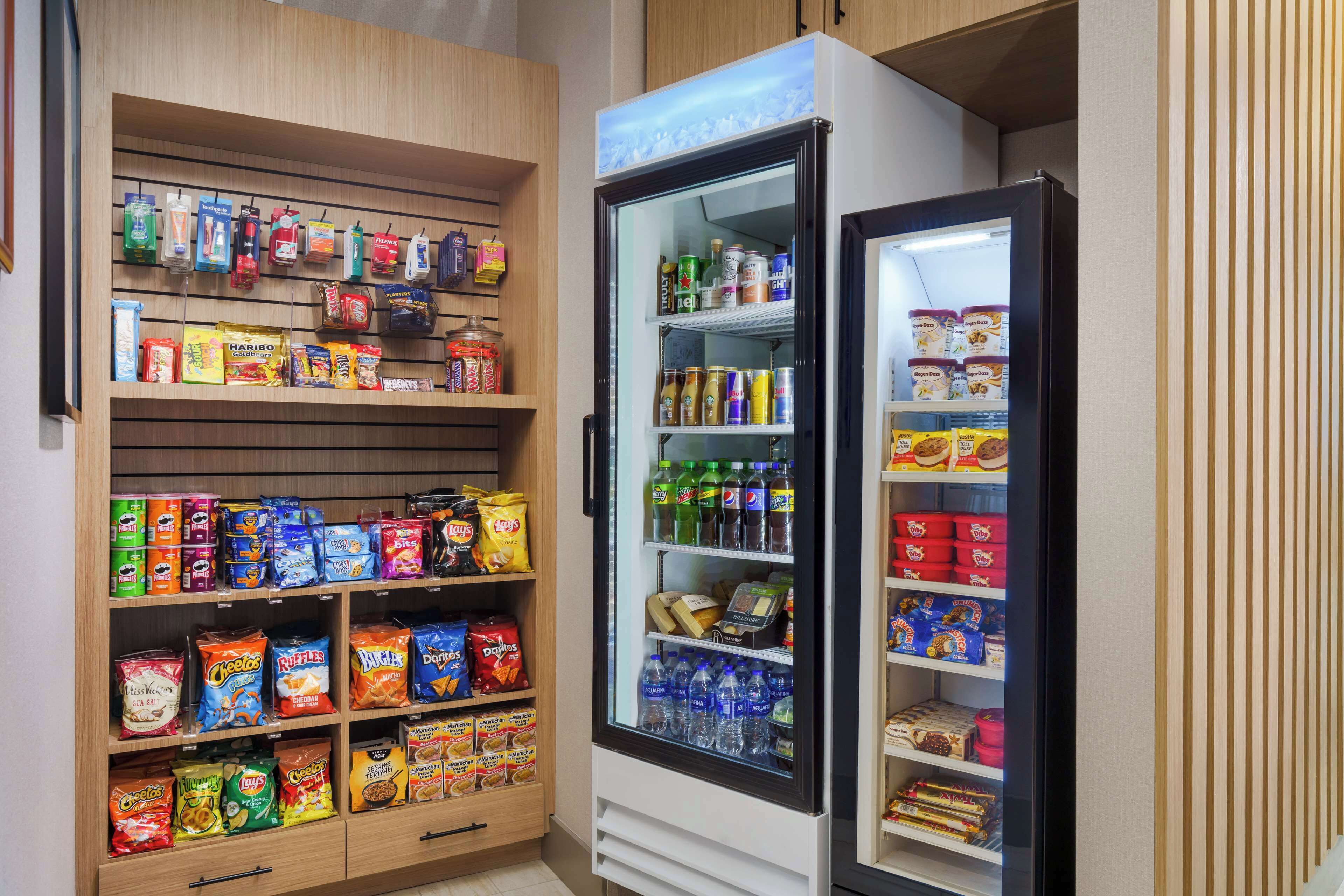 A snack and beverage vending area with various snacks and drinks.
