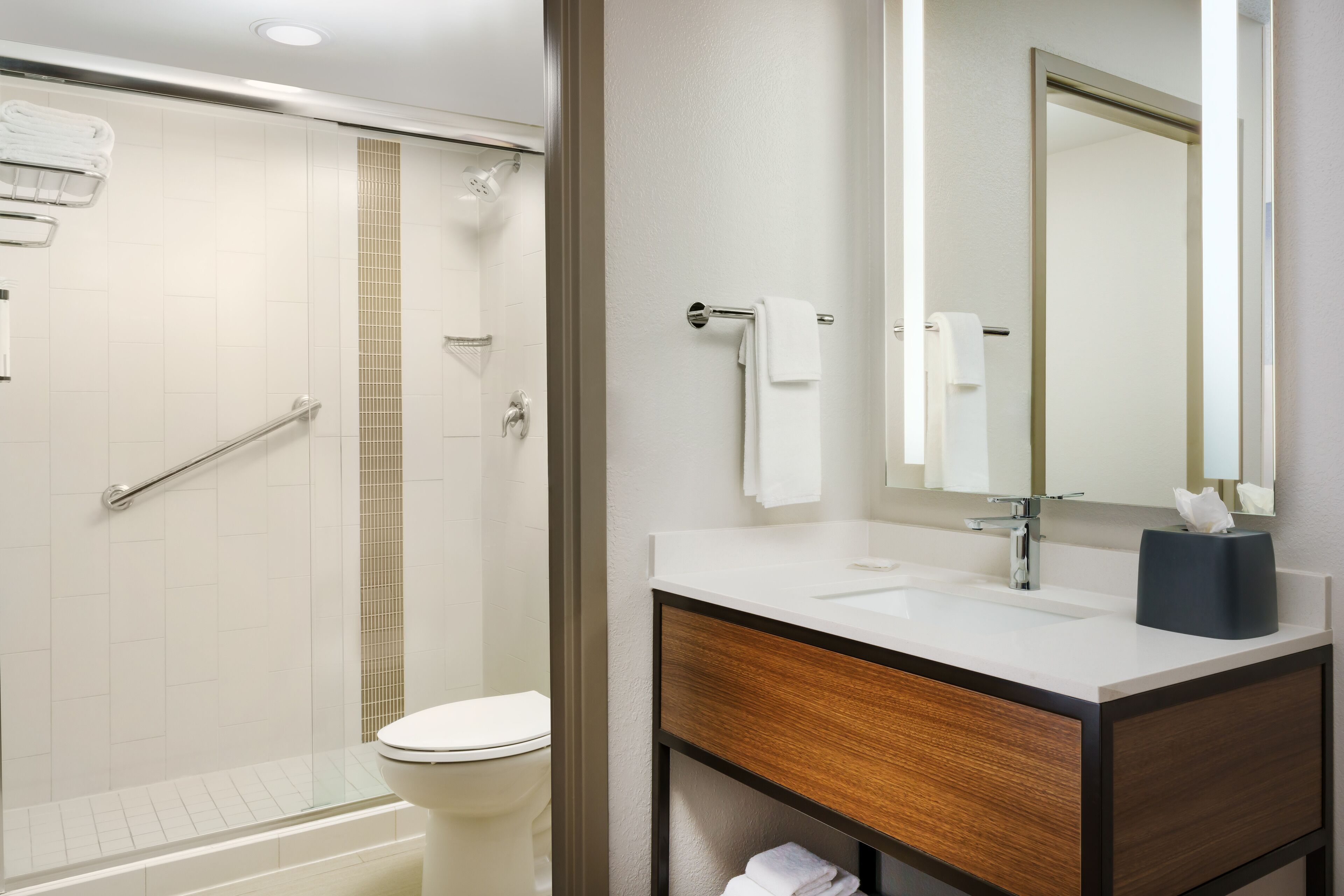 designer toiletries, hair dryer, towels