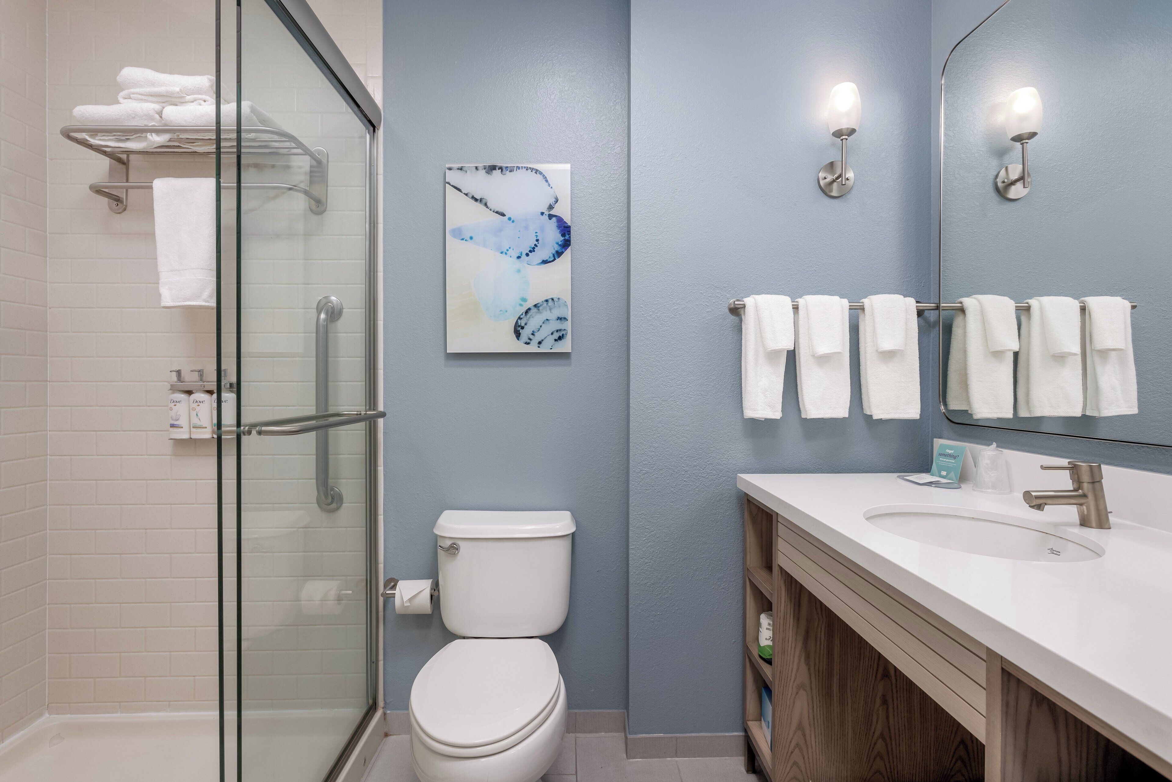 combined shower/bathtub, designer toiletries, hair dryer, towels