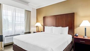 Desk, laptop workspace, blackout drapes, iron/ironing board