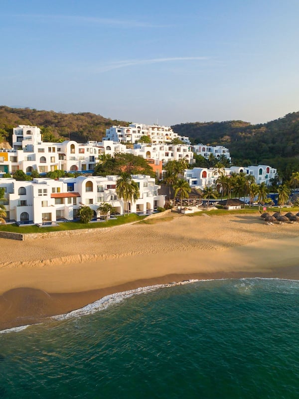 Enjoy ocean views from the balcony of this beachfront property.
