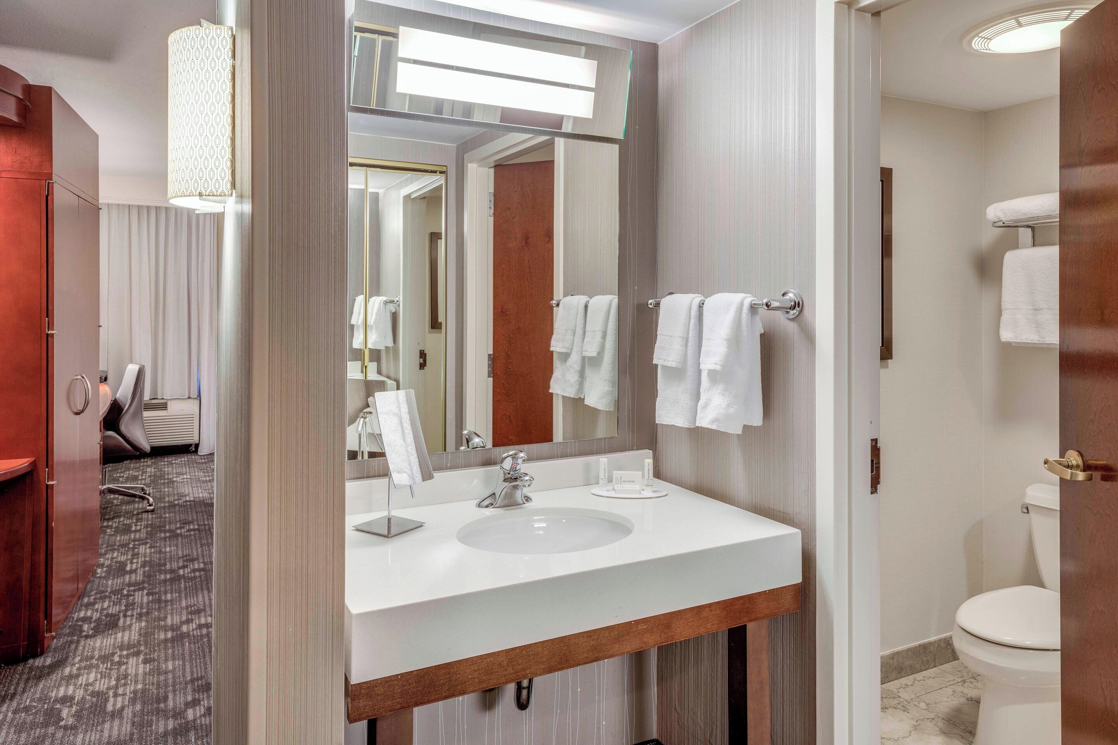 room, 2 queen beds | bathroom | combined shower/bathtub, free toiletries, hair dryer, towels