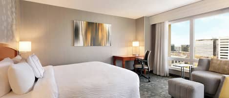 Hypo-allergenic bedding, desk, laptop workspace, blackout curtains