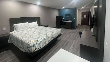 Desk, laptop workspace, blackout drapes, iron/ironing board