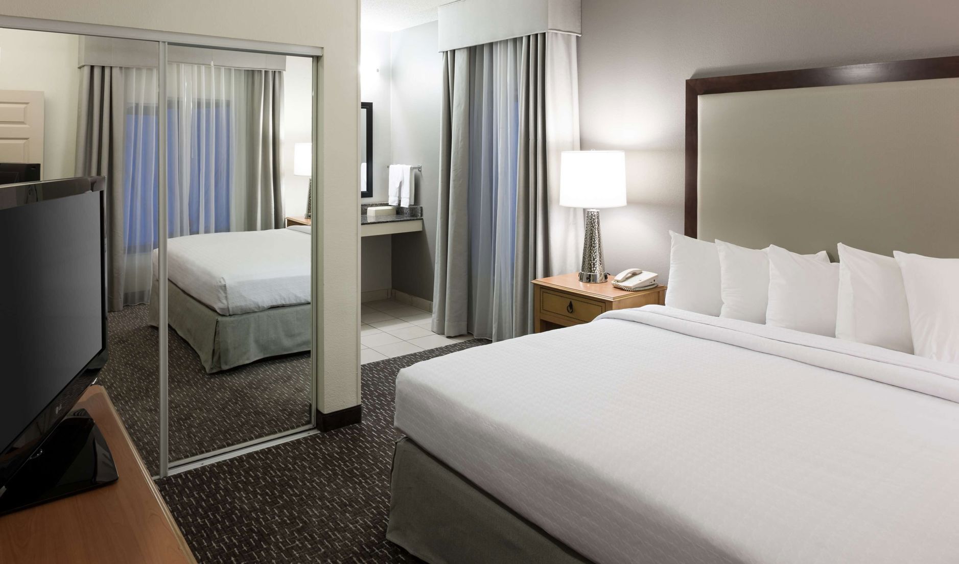Hypo-allergenic bedding, desk, blackout drapes, soundproofing