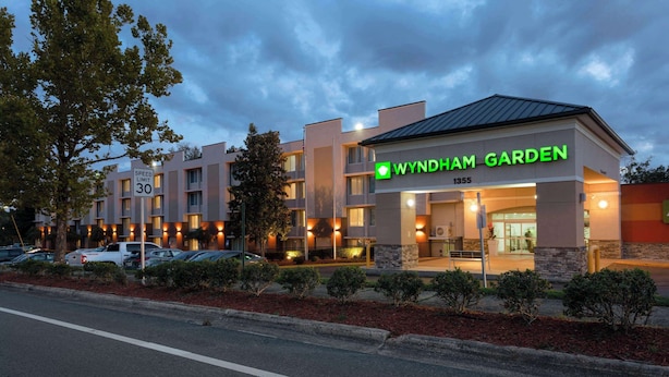 A modern building with a sign reading "Wyndham Garden."