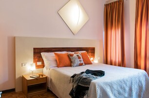 Classic Double Room | Minibar, in-room safe, iron/ironing board, cribs/infant beds