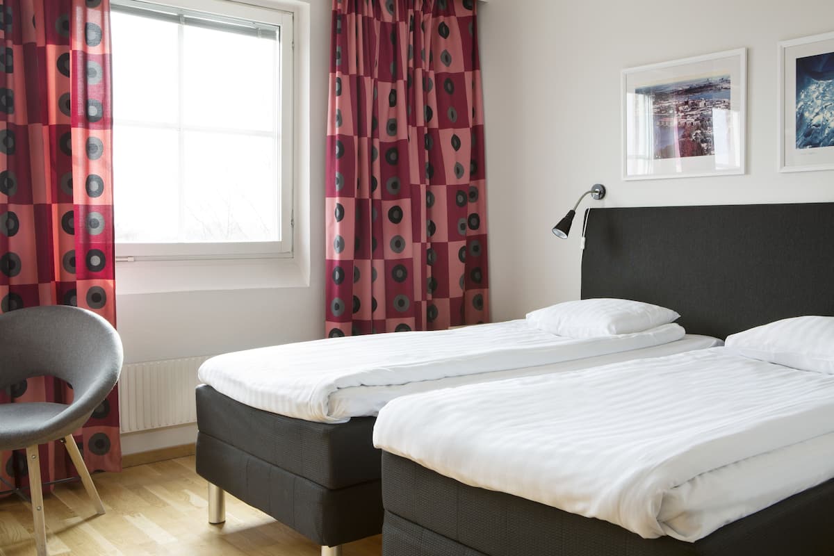 premium bedding, desk, blackout curtains, soundproofing