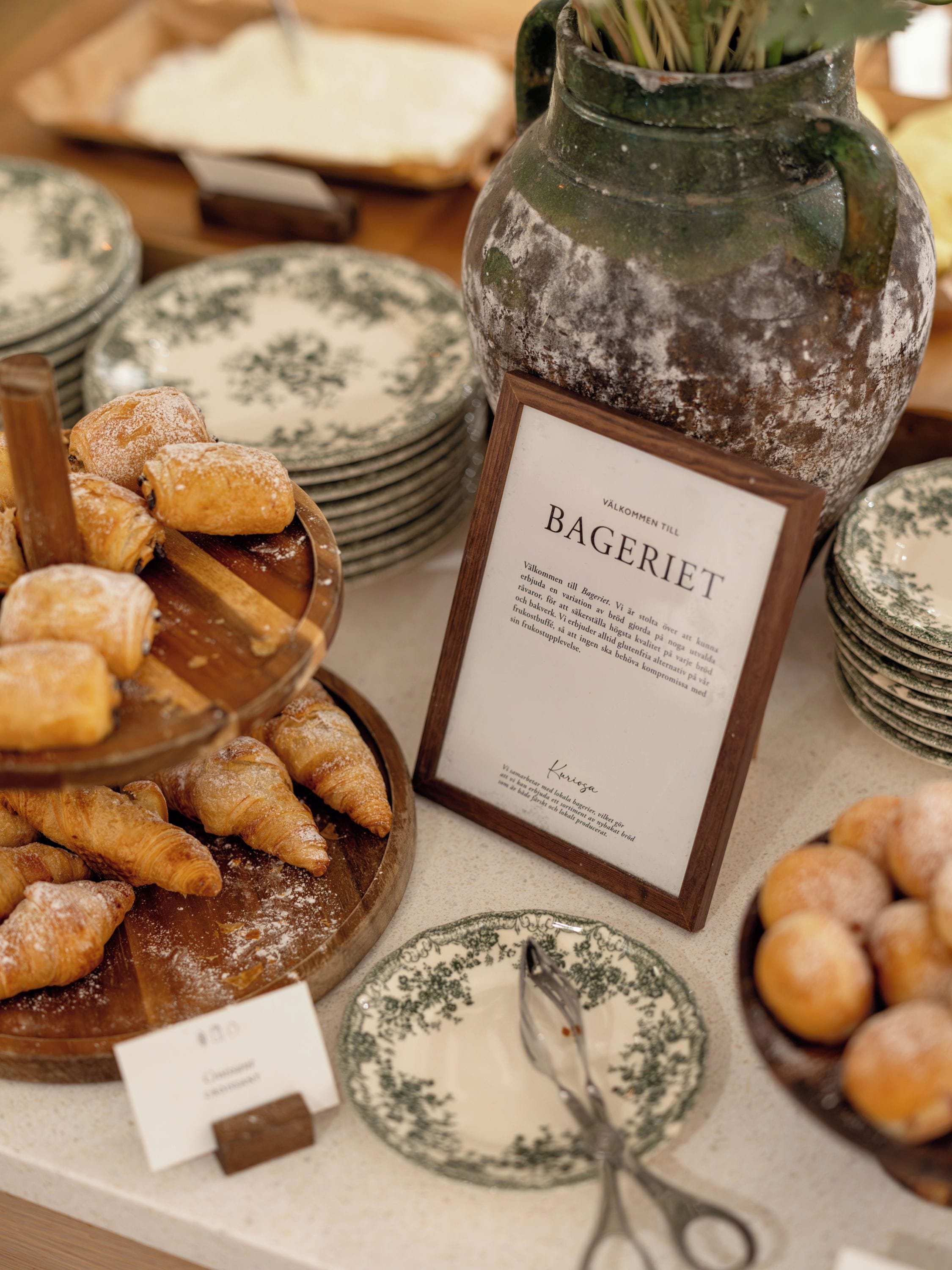 A display of pastries and a sign indicating the type of food.