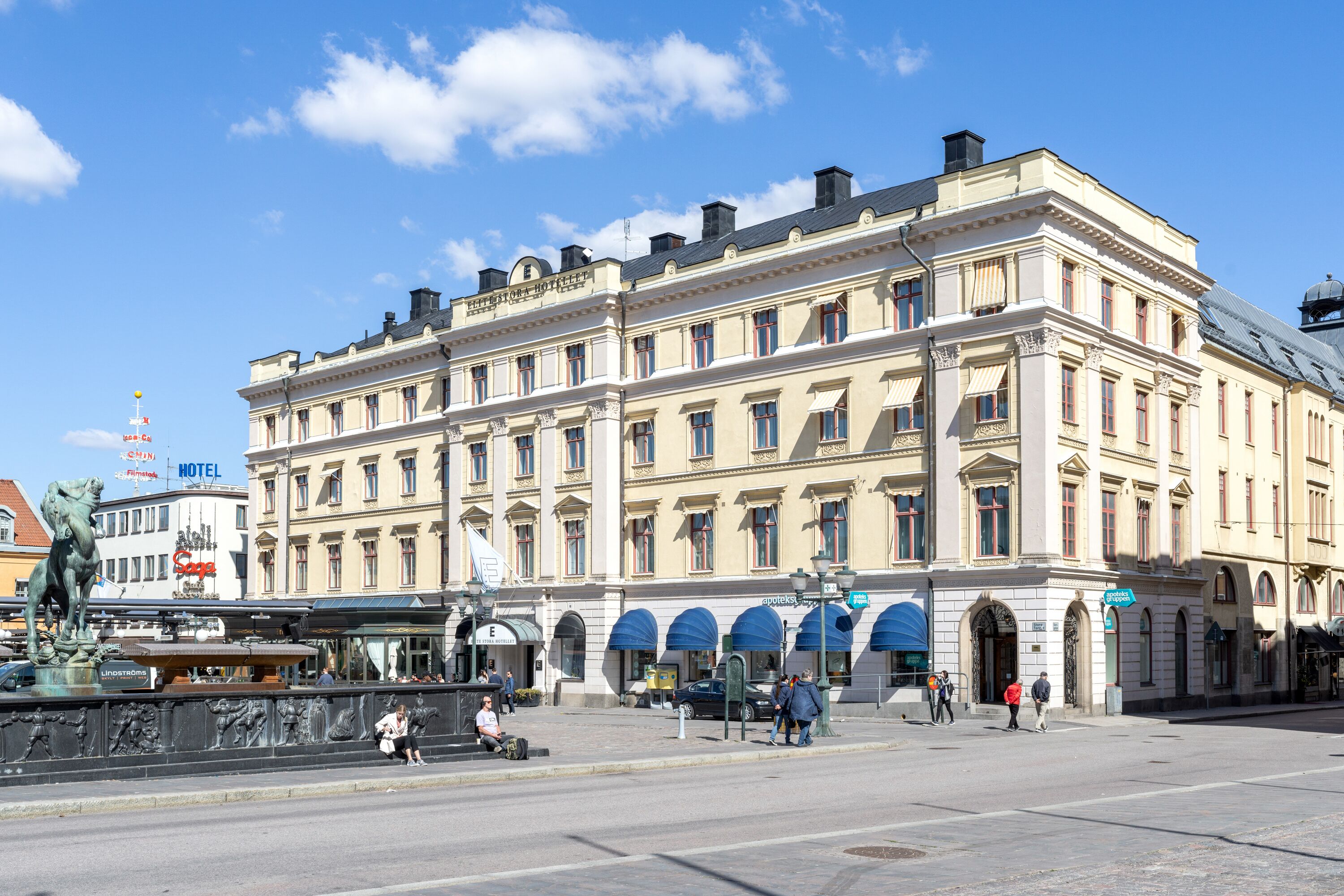 A historic building with classical architecture, featuring multiple stories, large windows, and a prominent entrance.