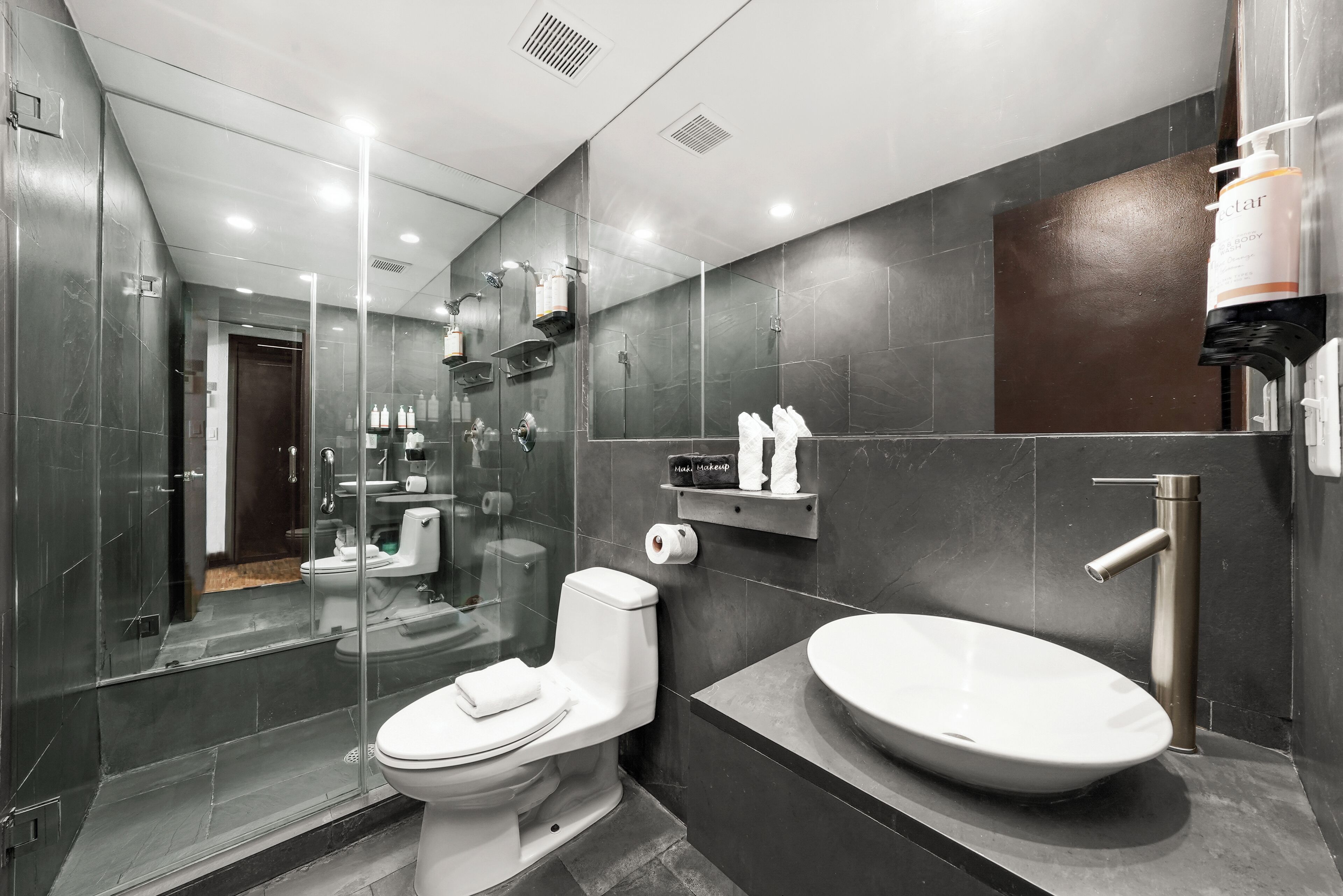 Shower, designer toiletries, hair dryer, bathrobes