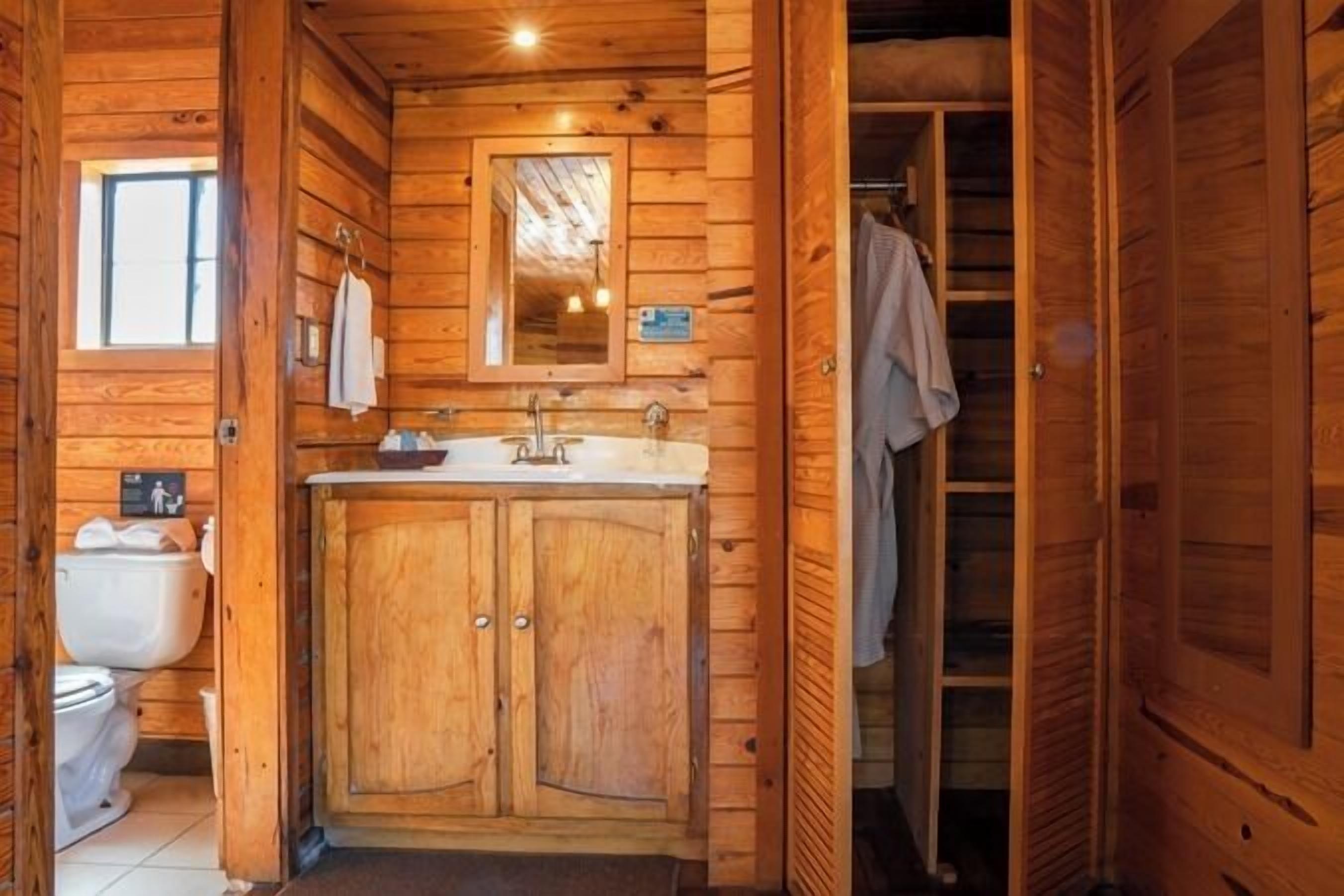 quadruple room (log) | bathroom | designer toiletries, hair dryer, towels