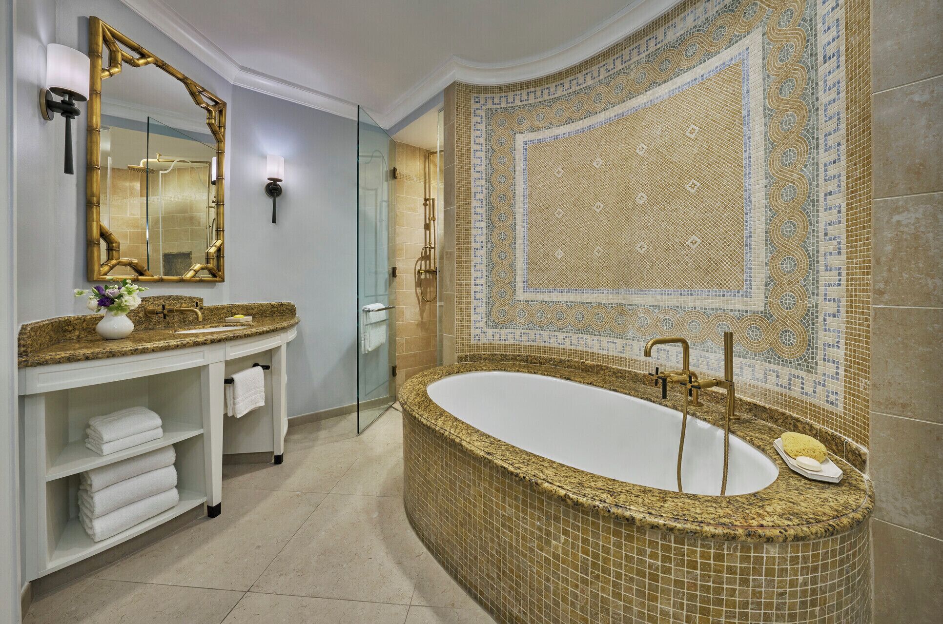 combined shower/bathtub, designer toiletries, hair dryer, bathrobes