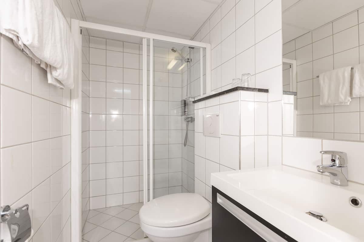 spring water bathtub, hair dryer, towels, soap