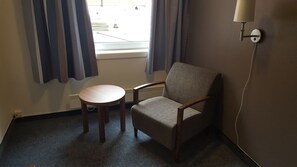 Standard Single Room | Living area | 32-inch flat-screen TV with cable channels