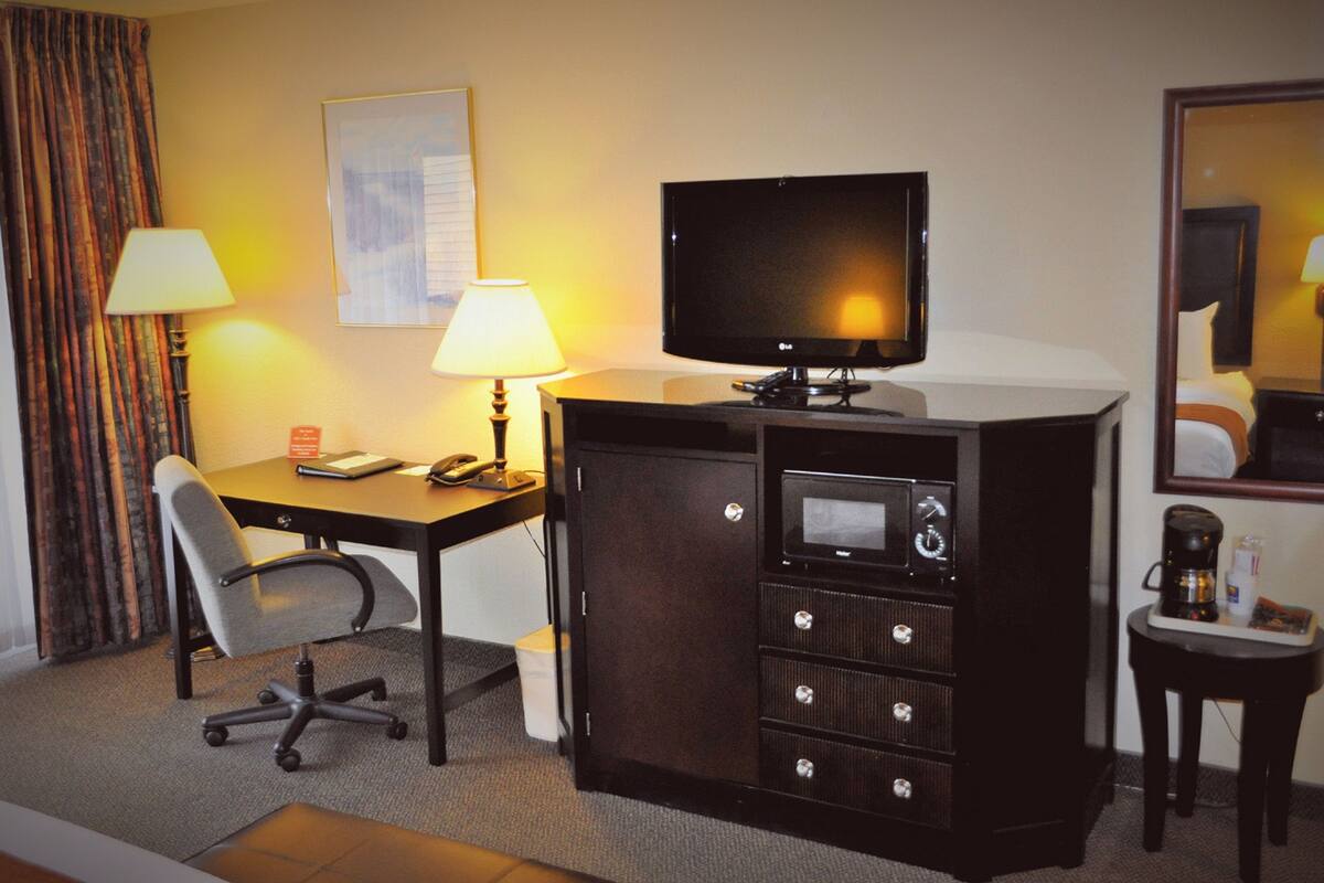 premium bedding, desk, blackout curtains, iron/ironing board