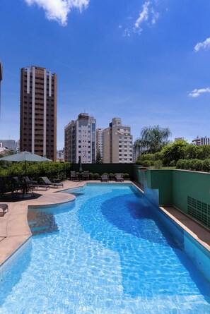 Outdoor pool, pool umbrellas, sun loungers