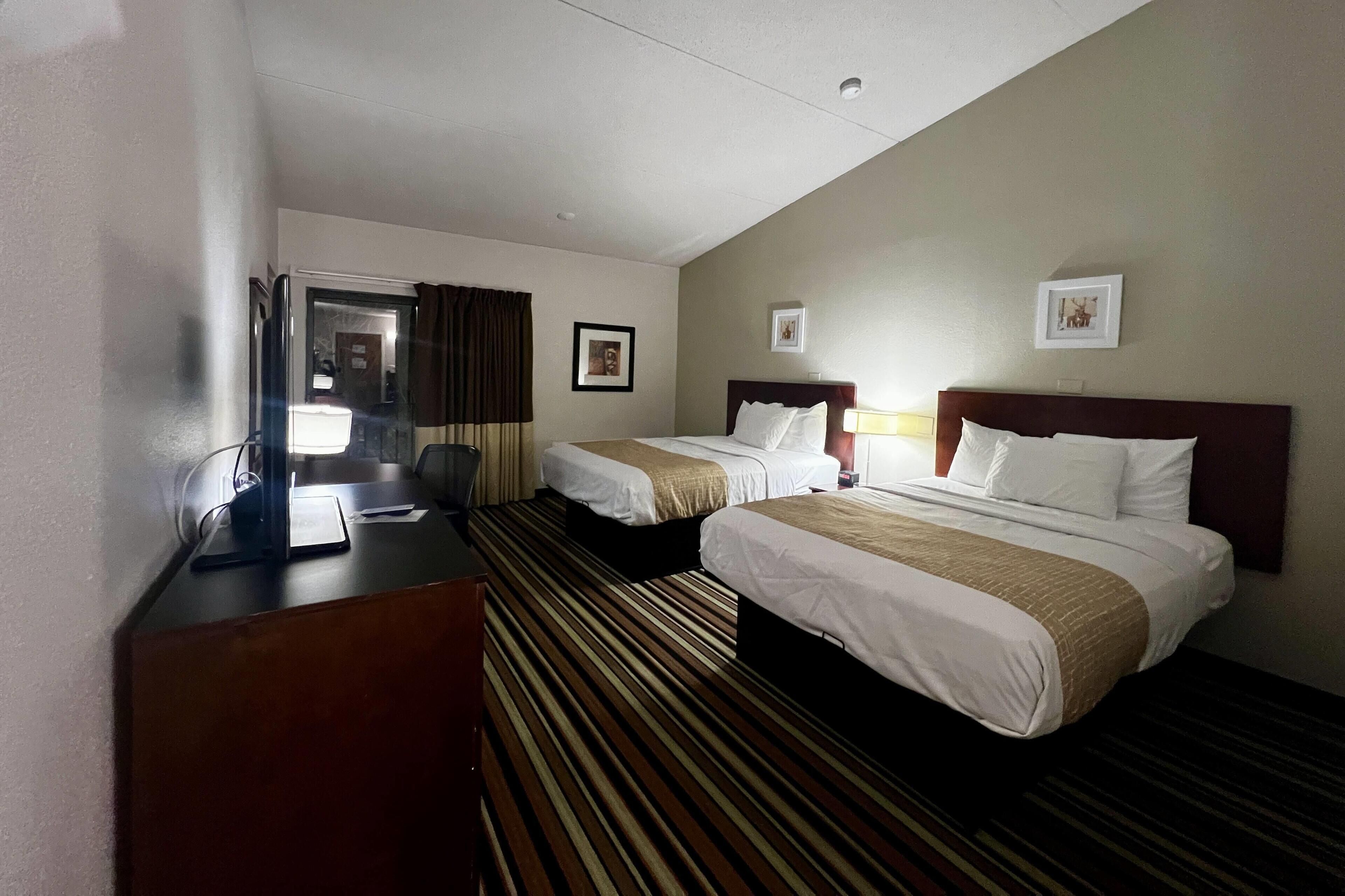 Pillowtop beds, desk, laptop workspace, blackout drapes