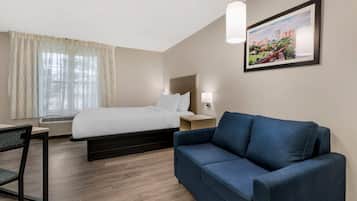 Premium bedding, desk, laptop workspace, iron/ironing board