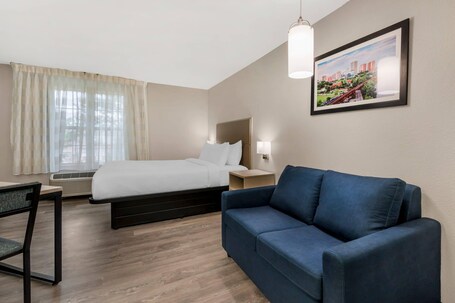 Premium bedding, desk, laptop workspace, iron/ironing board