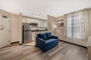 Premium bedding, desk, laptop workspace, iron/ironing board