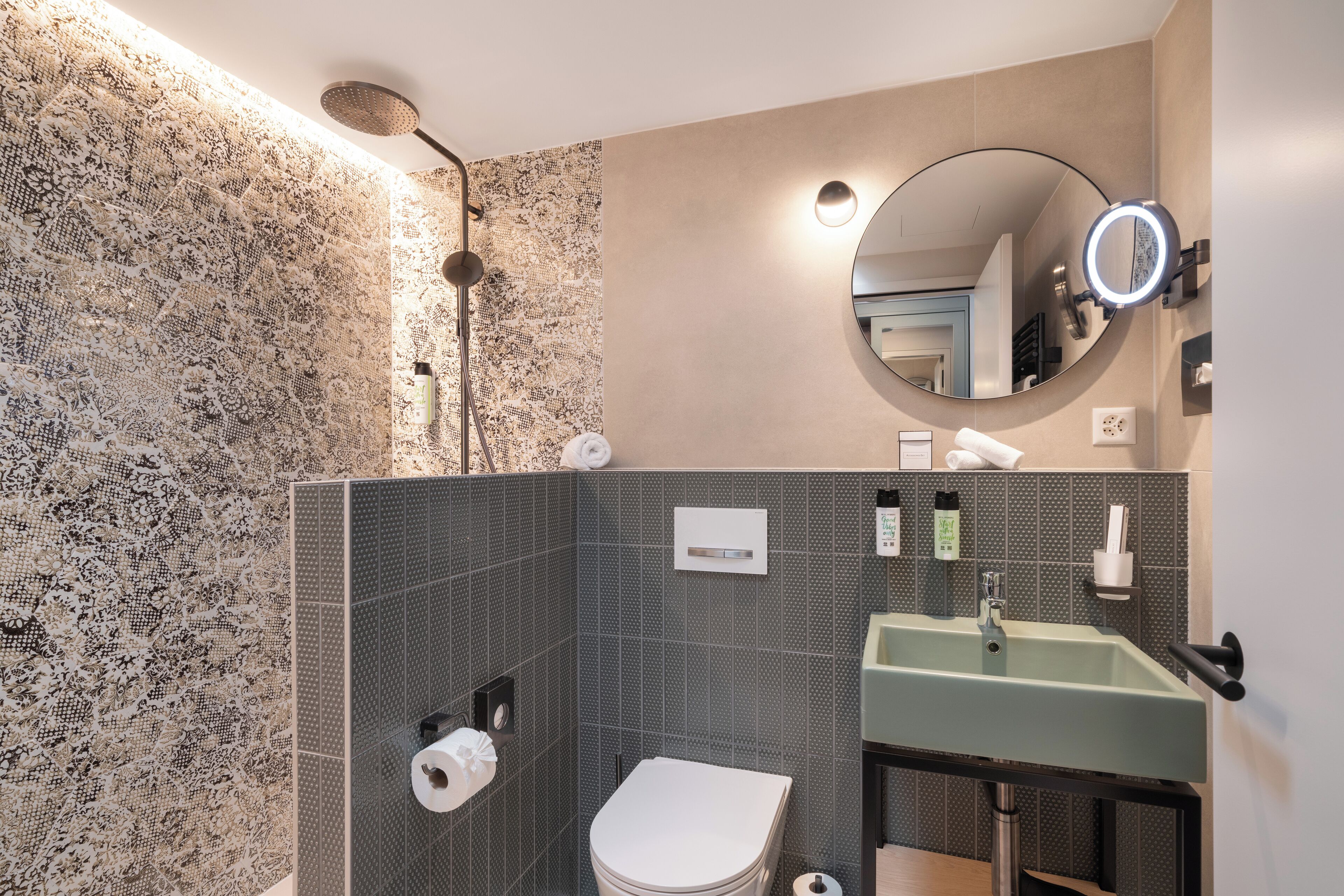 spacious roof top room | bathroom | free toiletries, hair dryer, bathrobes, slippers