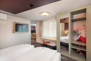 Spacious Roof Top Room | Minibar, in-room safe, individually decorated, individually furnished - Stella Swiss Quality Hotel (Interlaken)