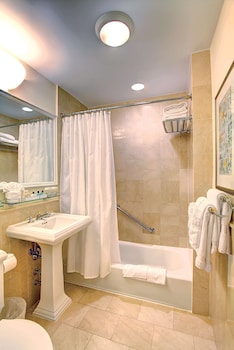 Combined shower/tub, eco-friendly toiletries, hair dryer, towels at Sea View Hotel, Bal Harbour, On The Ocean
